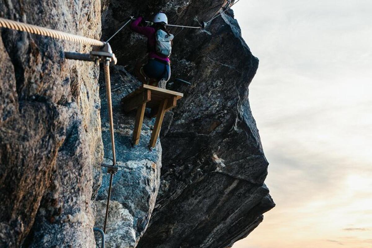 a person on a rock climbing on a cliff