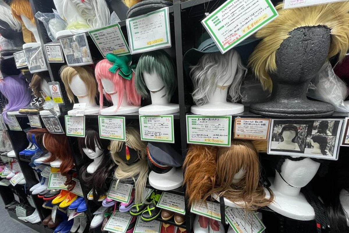 a bunch of dolls on display in a store
