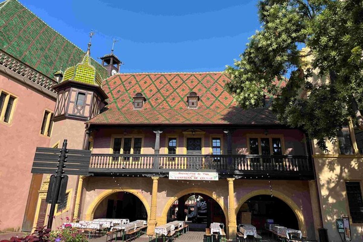a building with a balcony and a building with tables