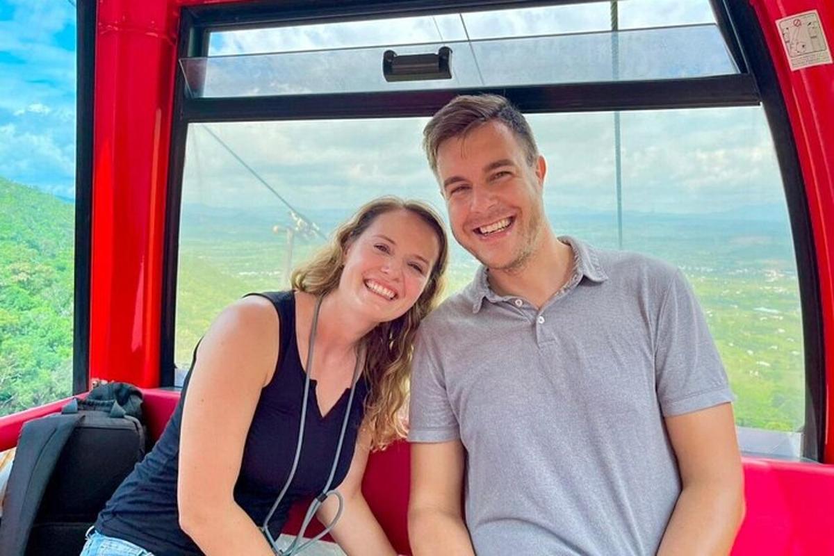 a man and a woman sitting on a train