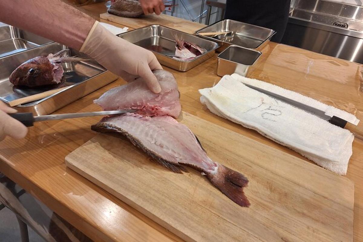 a person cutting a piece of meat on a cutting board