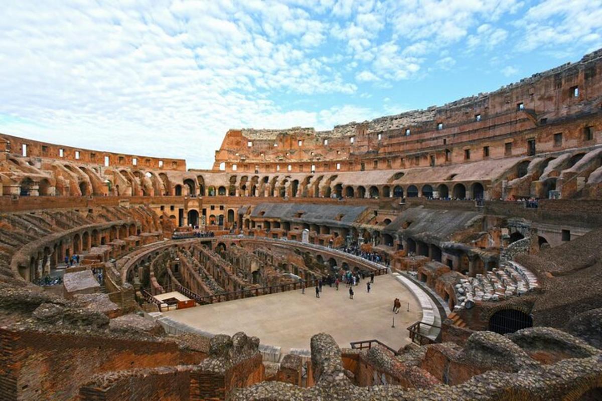 a large amphitheater with people walking inside of it