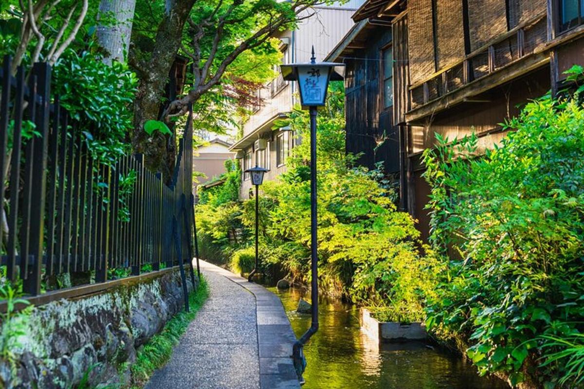 a street with street lights next to a river