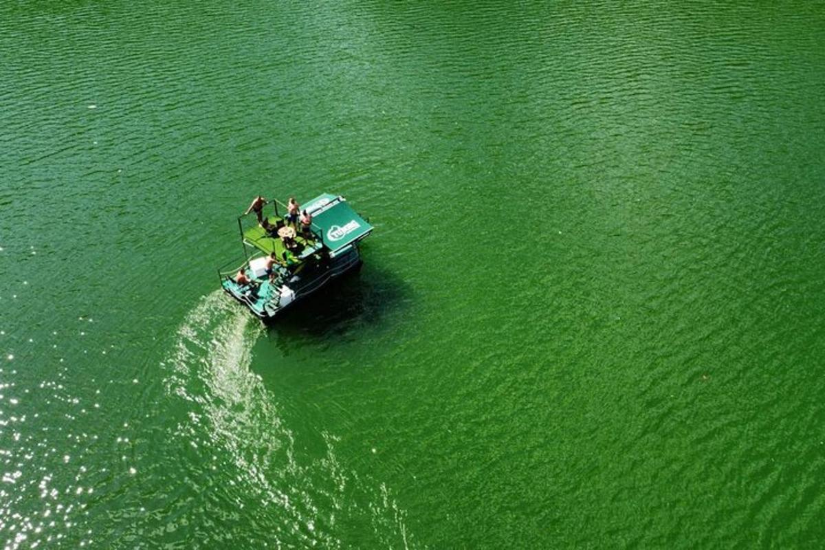 a group of people on a boat in the water