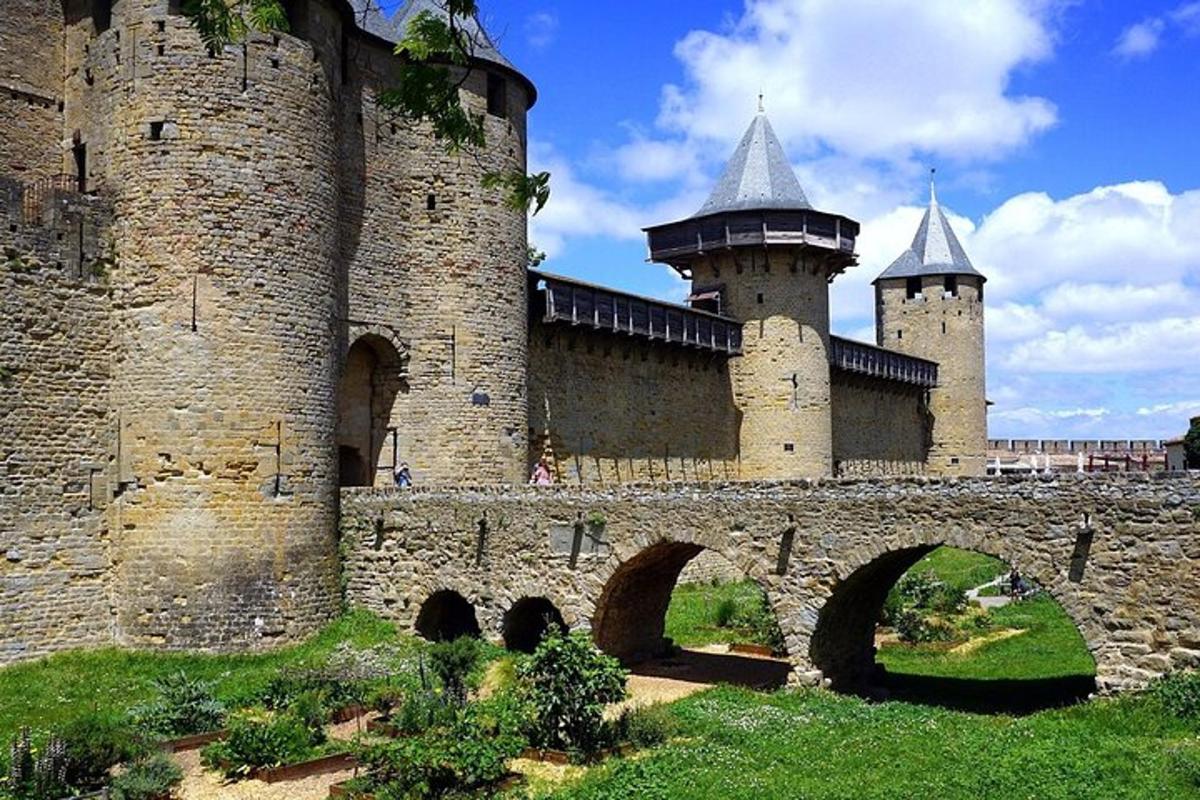 a large castle with a bridge in front of it