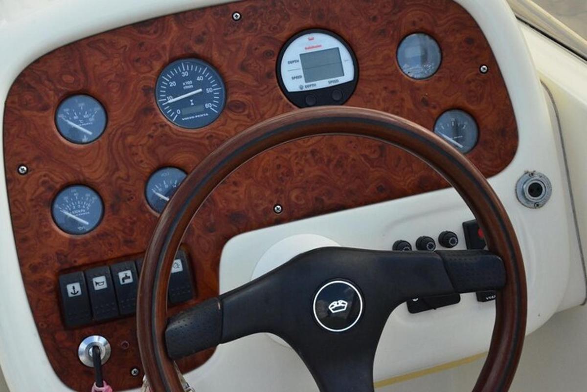 a close up of a steering wheel of a boat