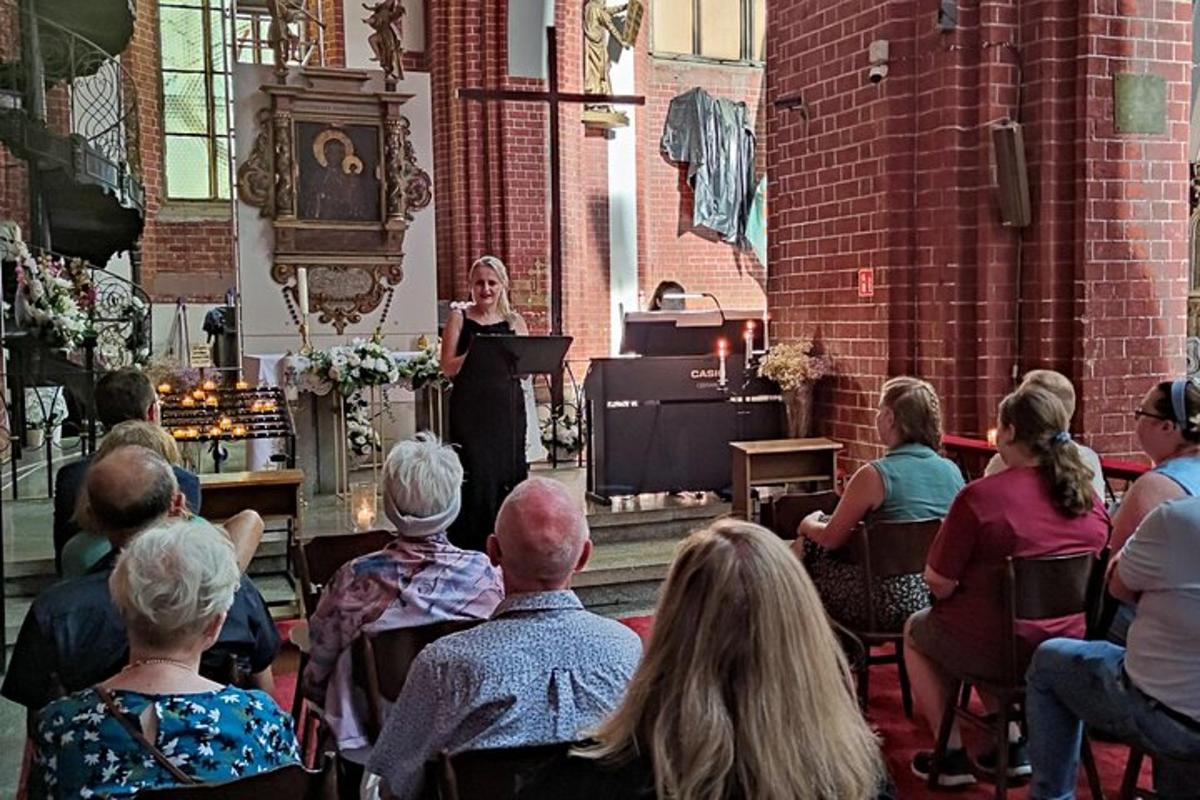 a woman standing in front of a podium in a church