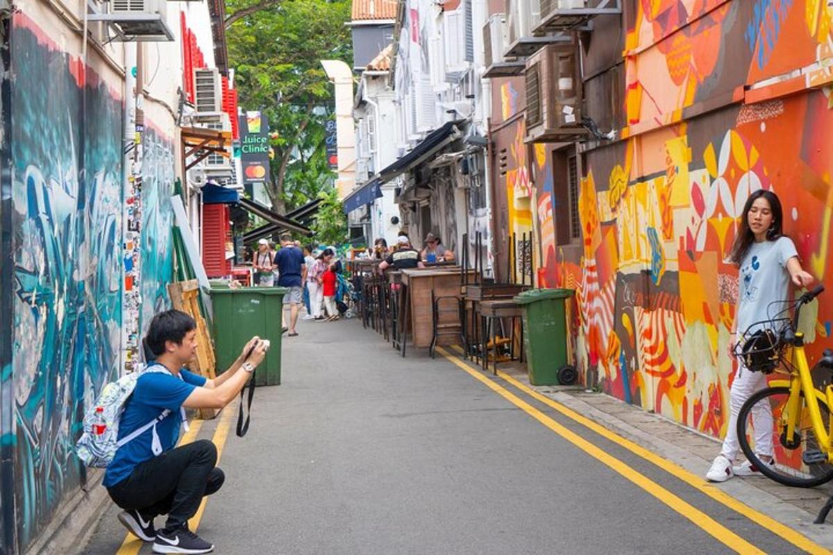 a man on a skateboard on a street with graffiti
