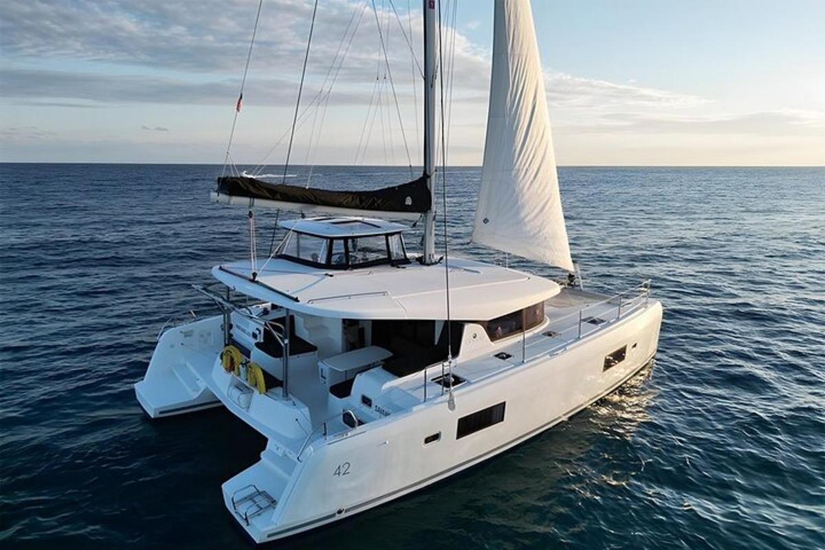 a white sailboat floating in the water