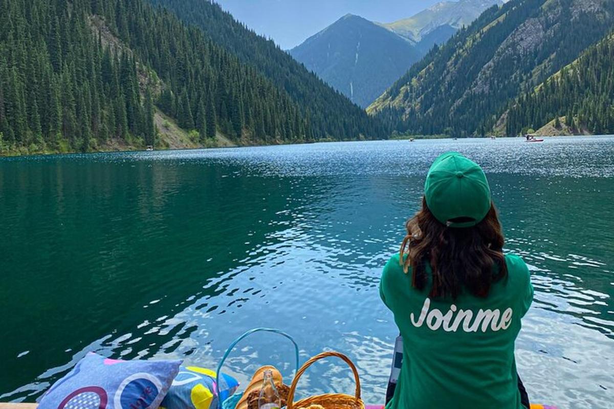 a woman sitting on a boat on a lake