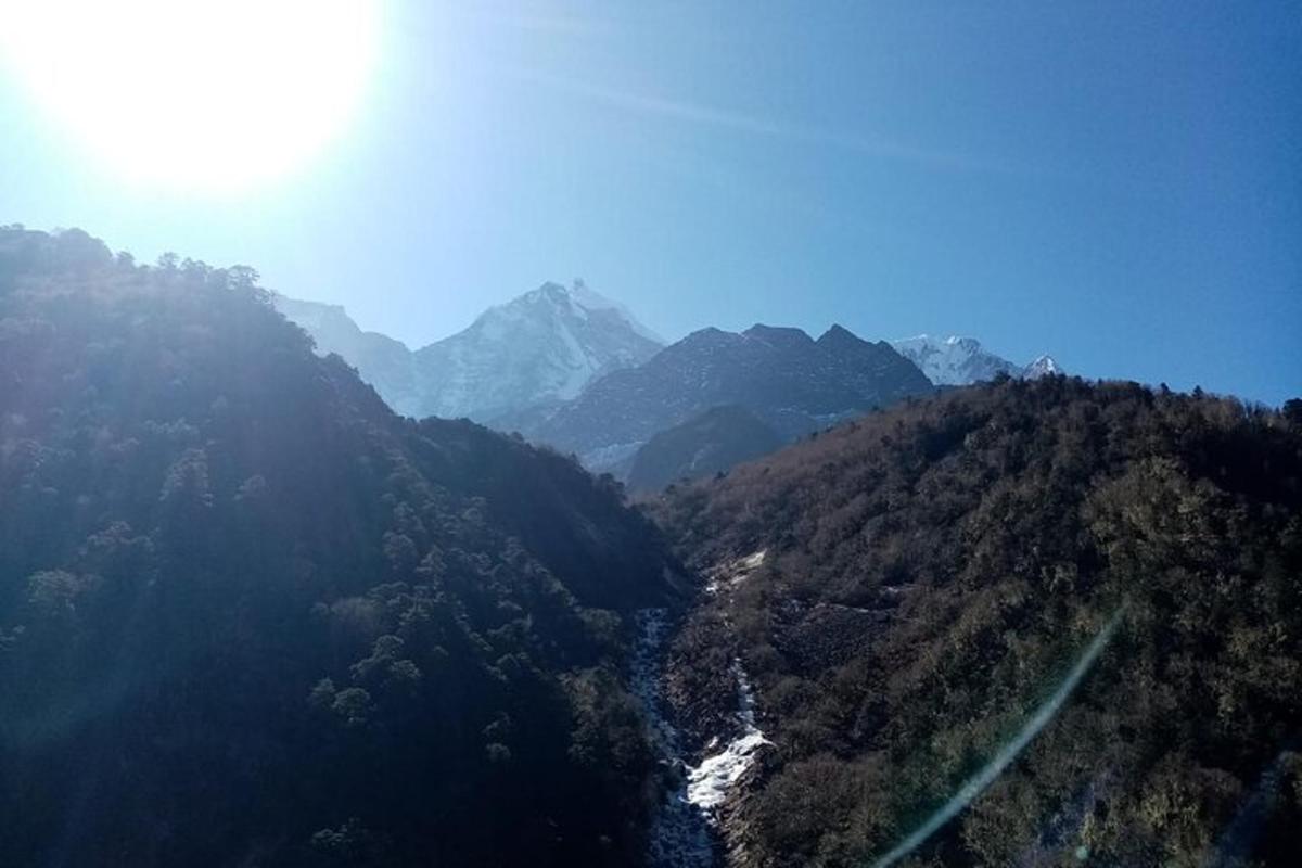 an aerial view of a mountain with a river