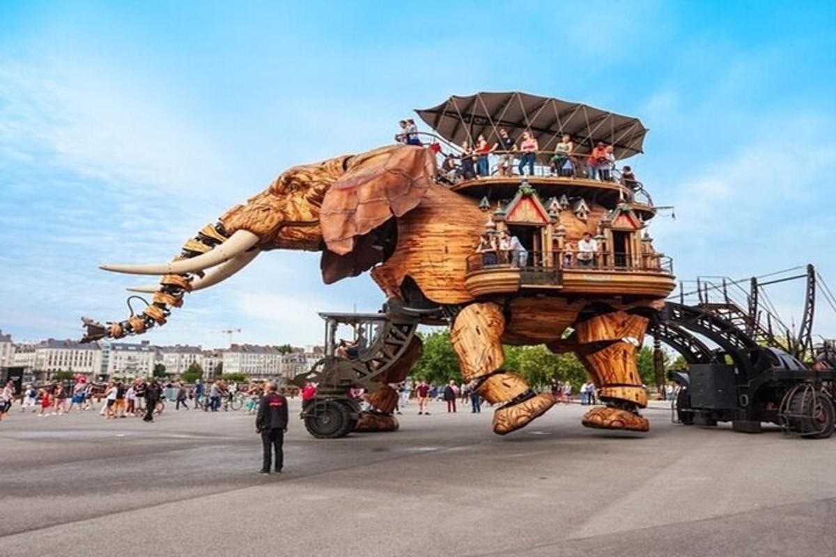 a large elephant float with people riding on it