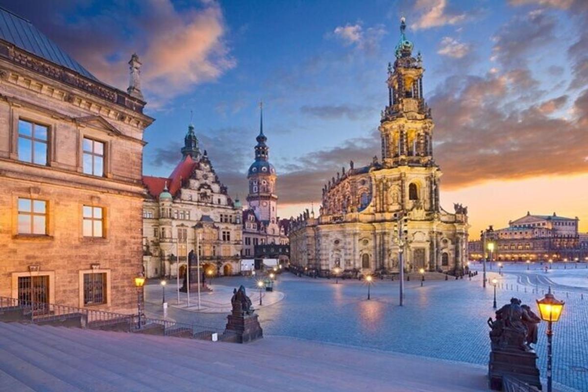 a group of buildings in a city at dusk
