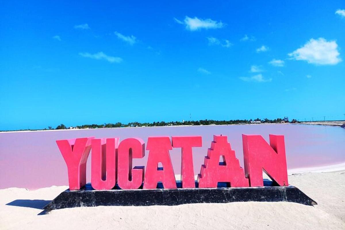 a sign in the sand on a beach