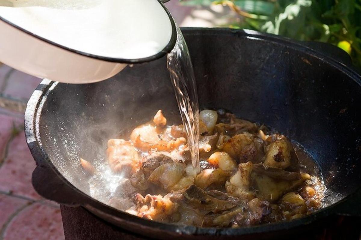 a pot of food is being being cooked