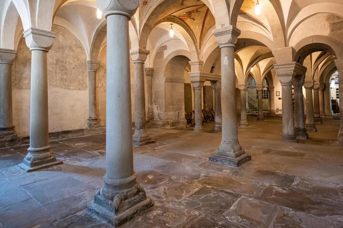an empty room with columns in an old building