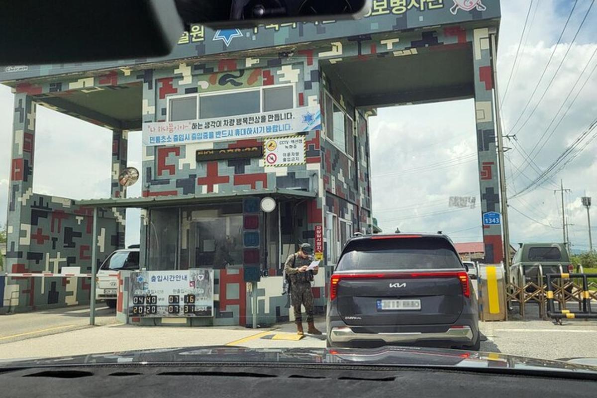a man standing in front of a gas station