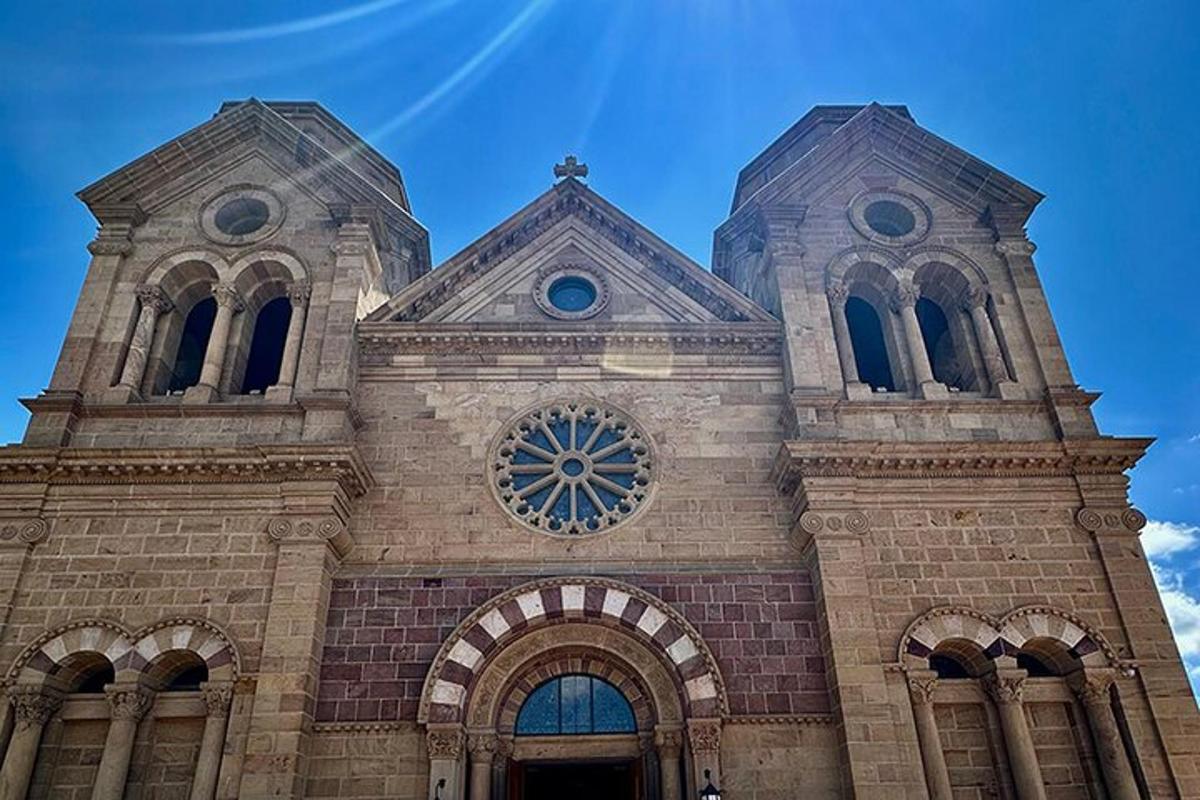 a church with two towers with a clock on it