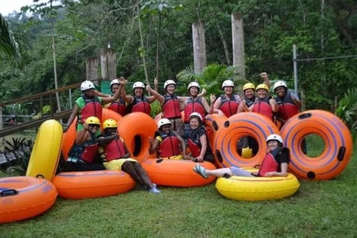 a group of people are posing for a picture in an inflatable raftstrokeuct