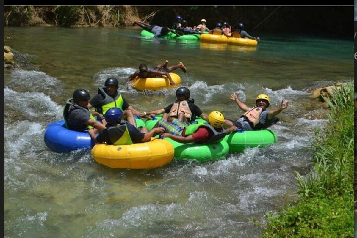 a group of people rafting down a river
