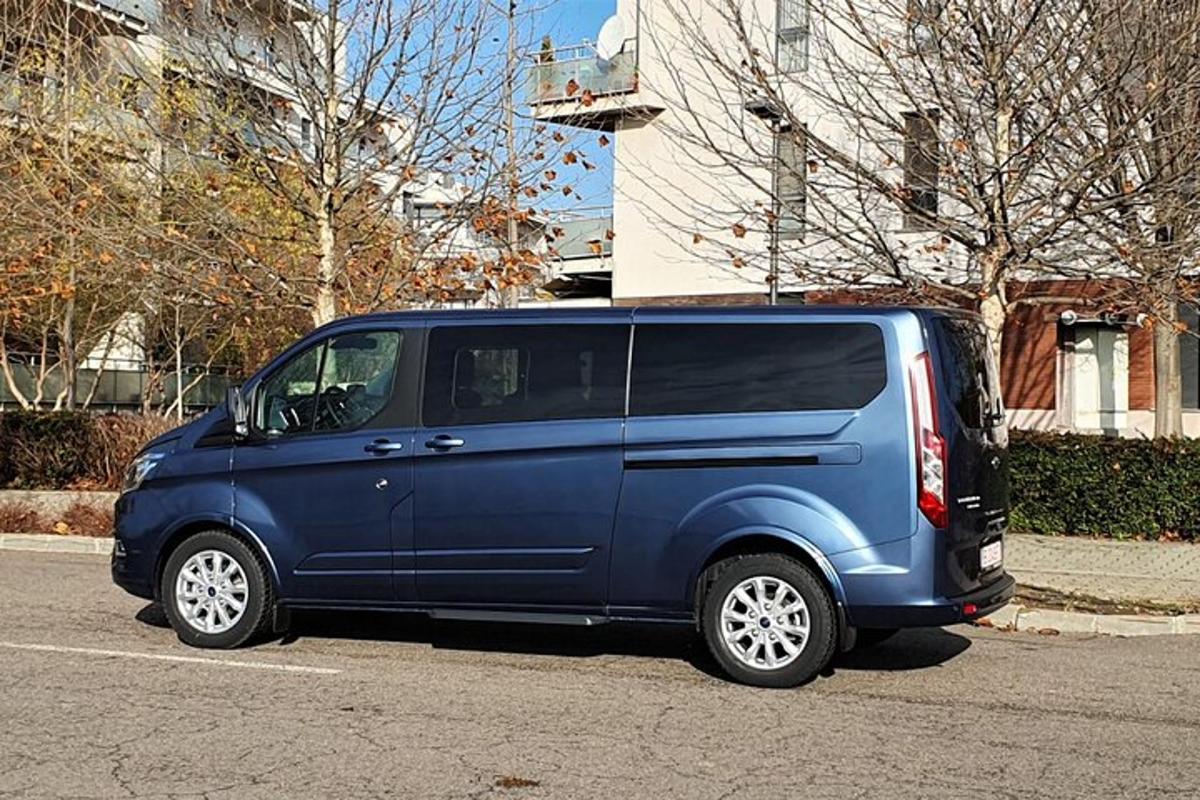 a blue van parked in a parking lot