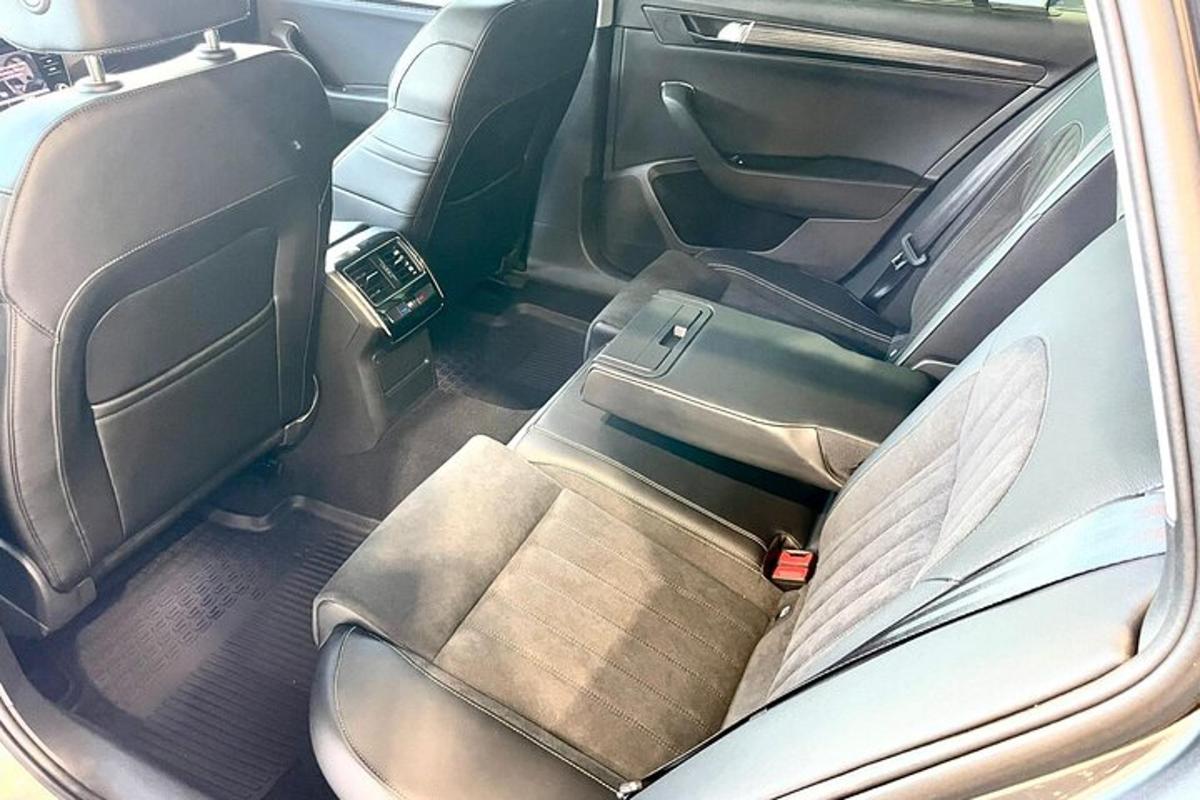 an open back seat of a car with the back seatsktop