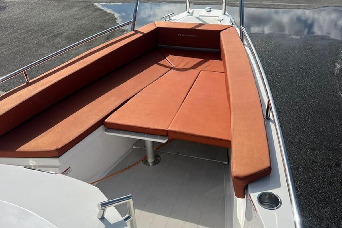 a wooden bench on the back of a boat