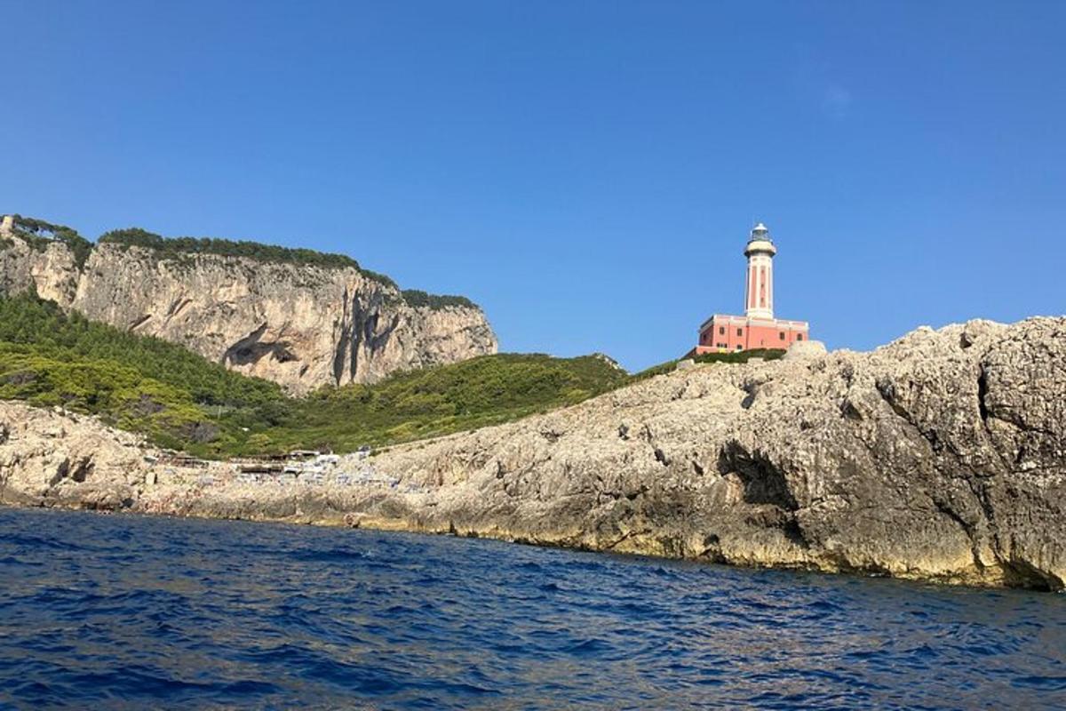 a lighthouse on the side of a rocky cliff