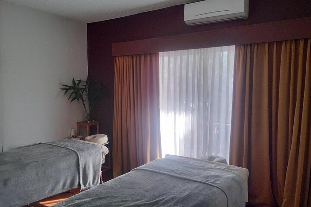 a hospital room with two beds and a window