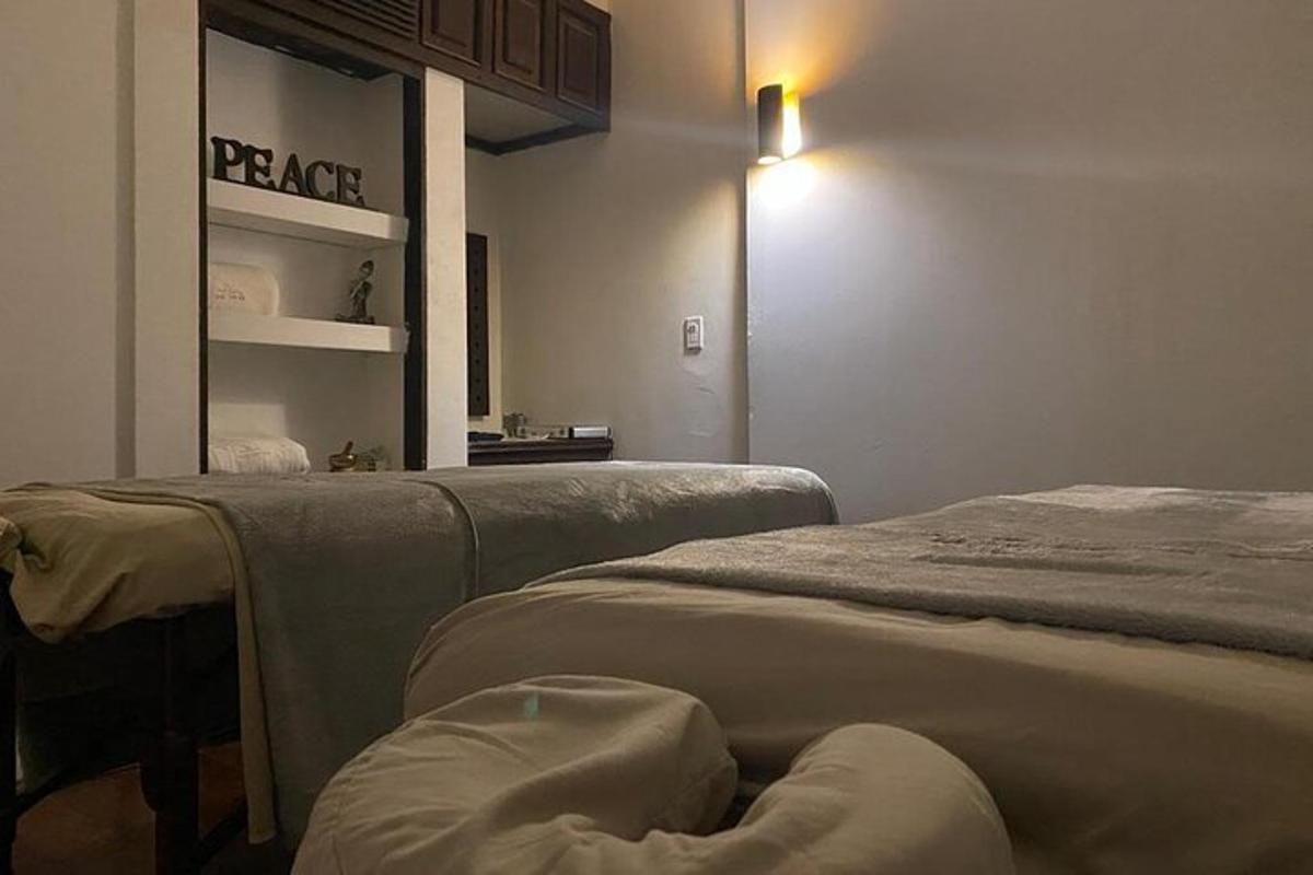 a room with two beds in a room