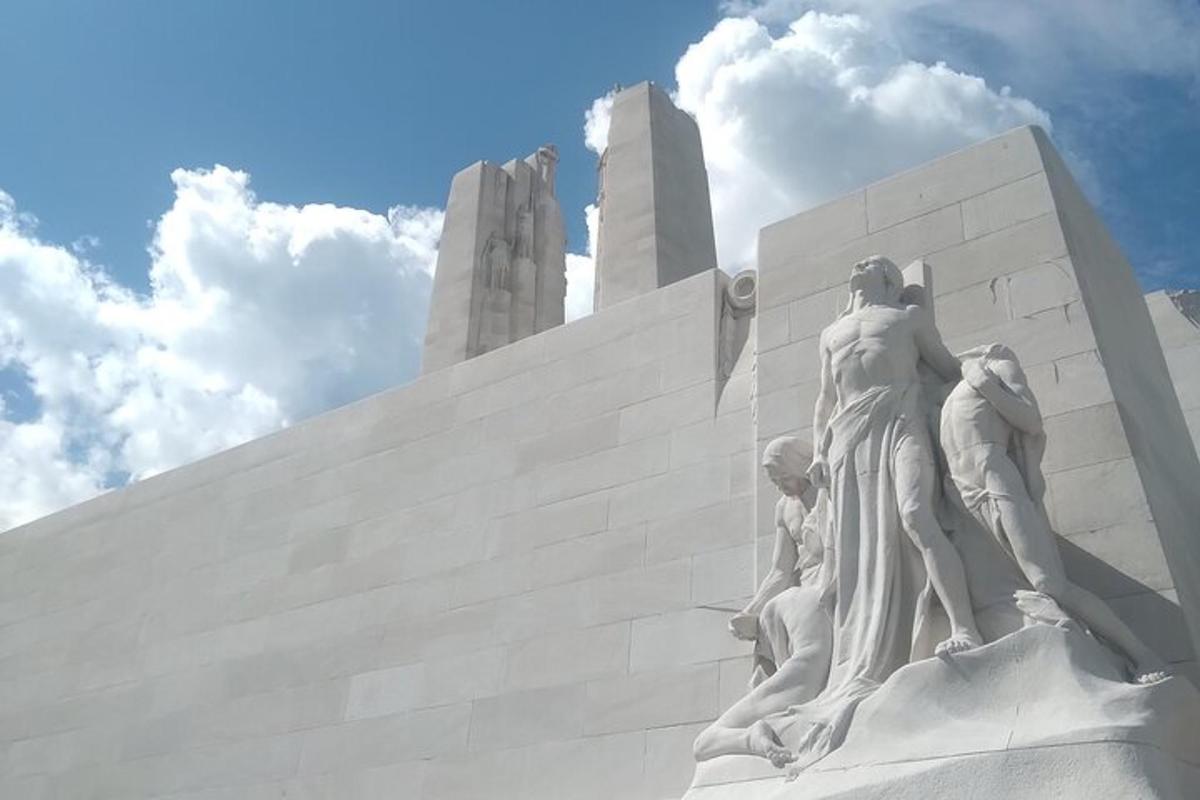 a statue of a group of people on a monument