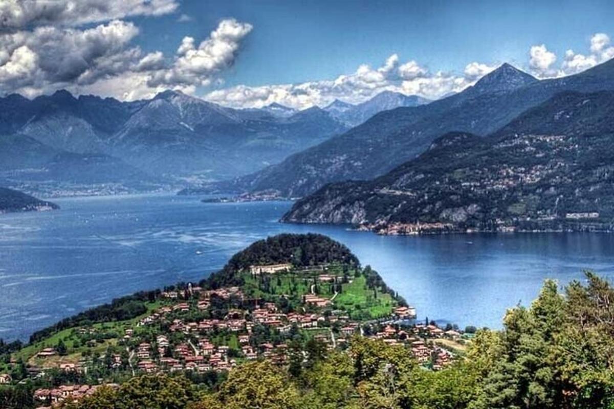 a town on a hill next to a body of water