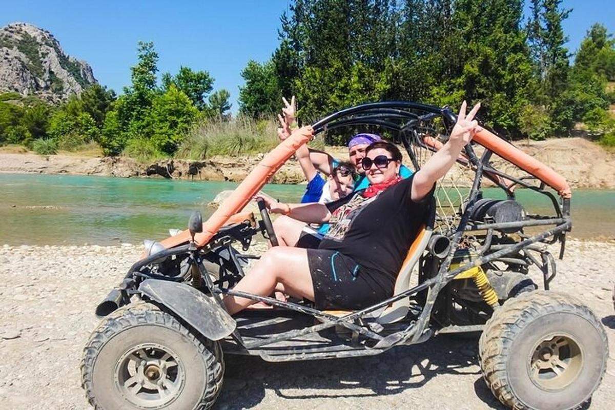 isang grupo ng mga taong nakaupo sa isang four wheeler na sasakyan