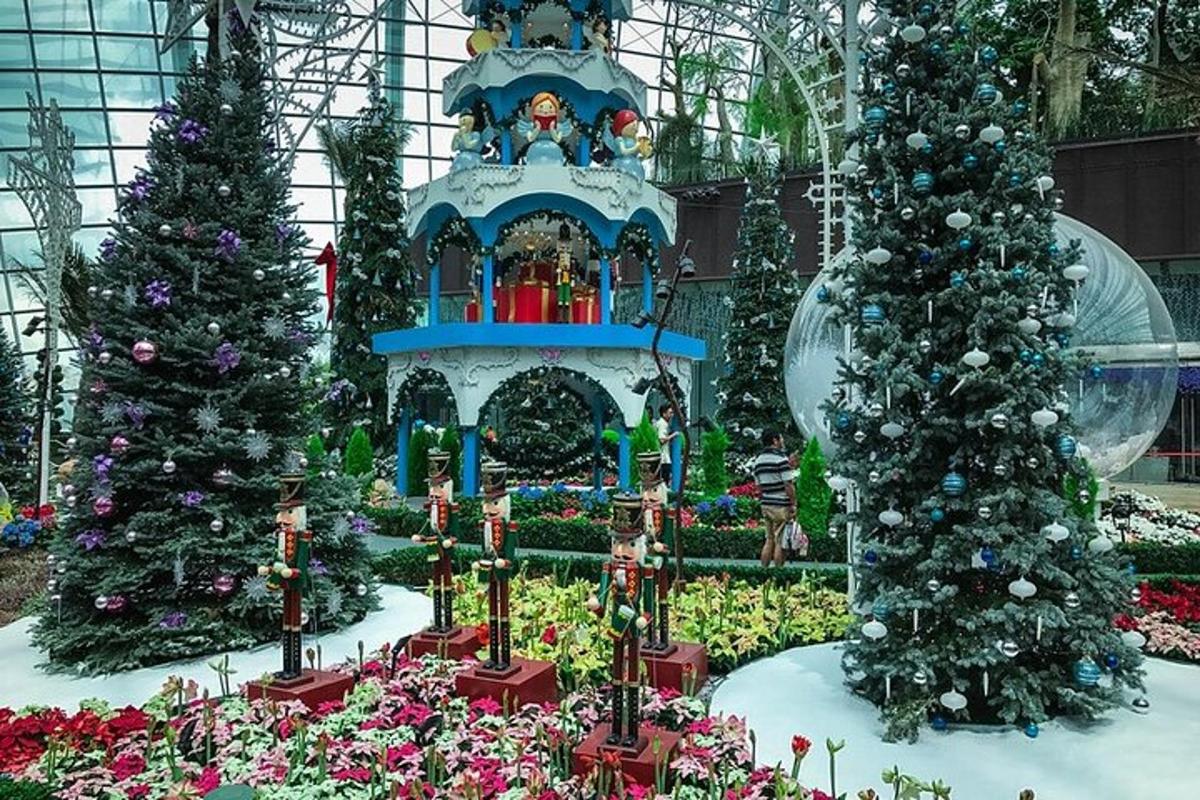 a display of christmas trees and plants in a building