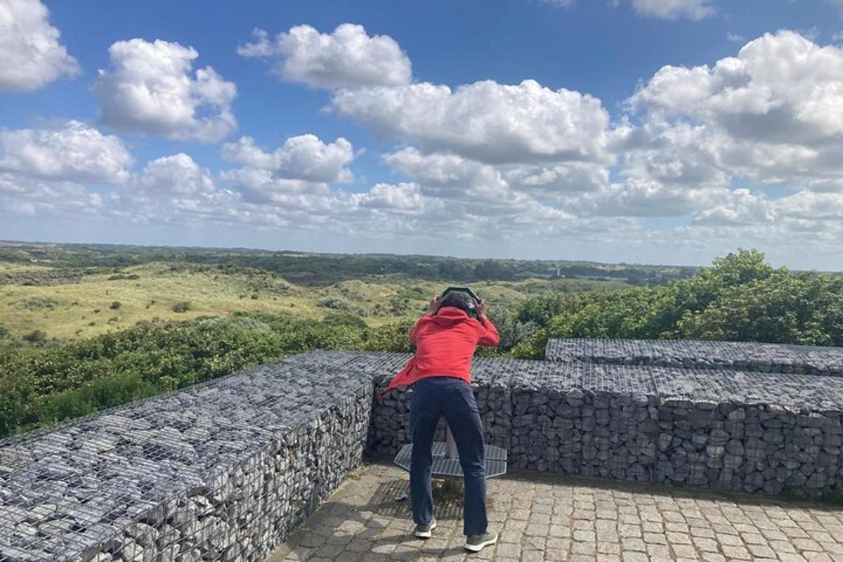 a woman standing on top of a stone wall