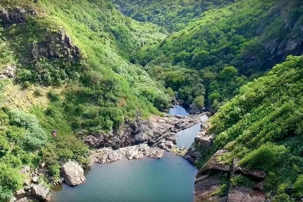 an aerial view of a river in a valley