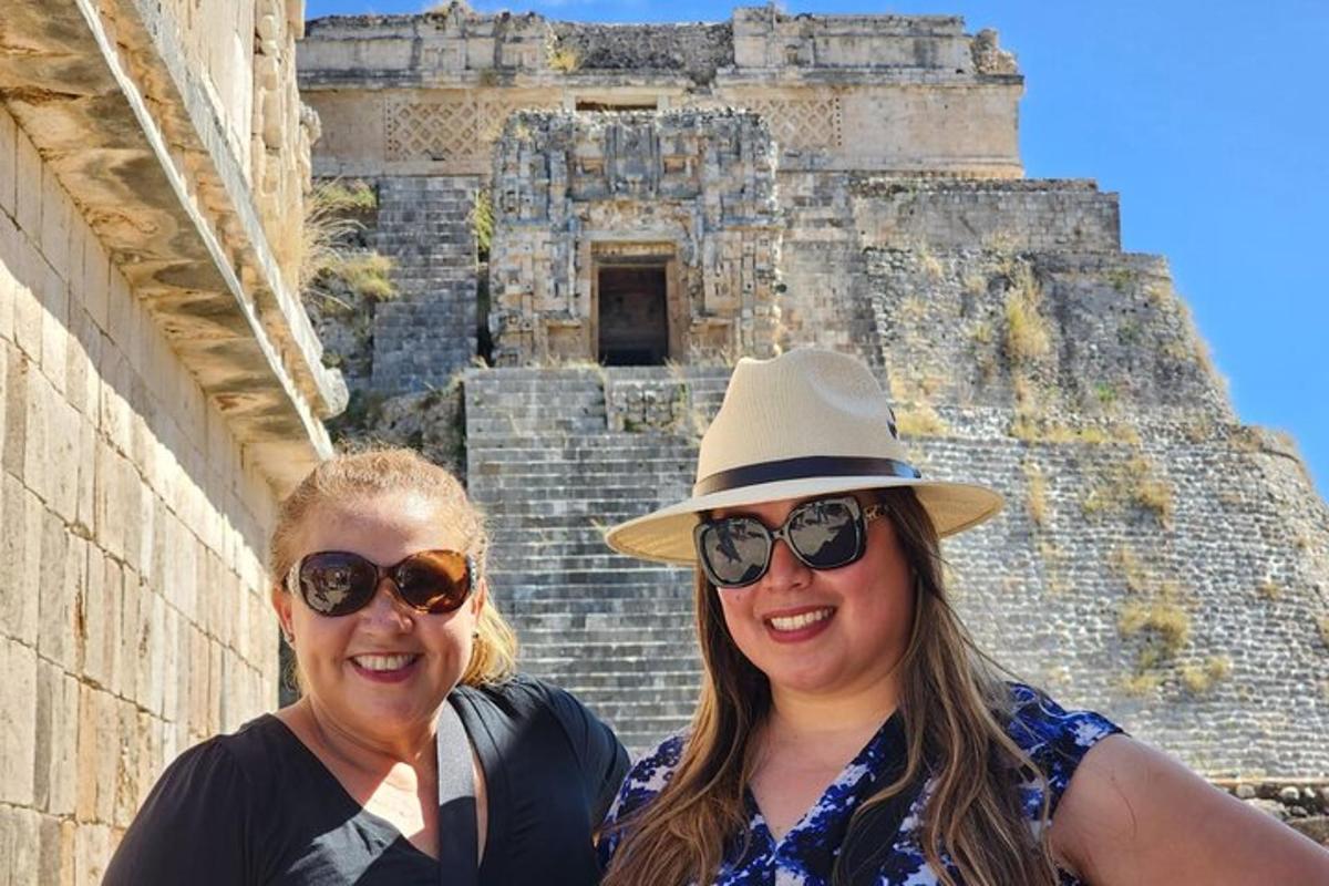 two women standing in front of a building