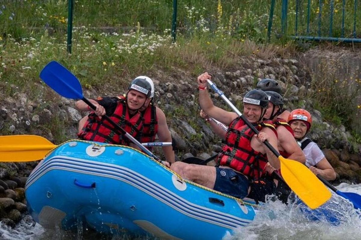 a group of people rafting down a river