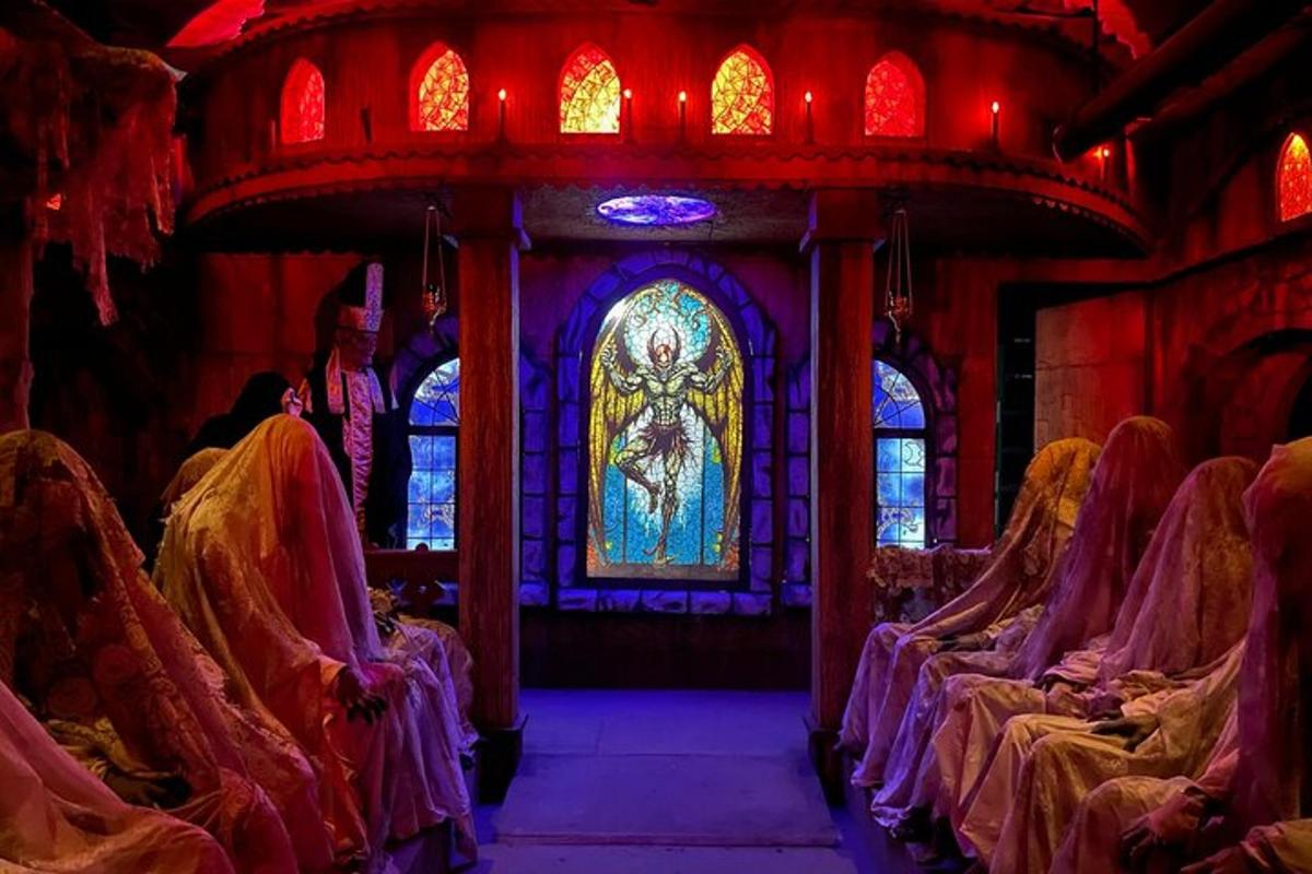 a church with a stained glass window and chairs