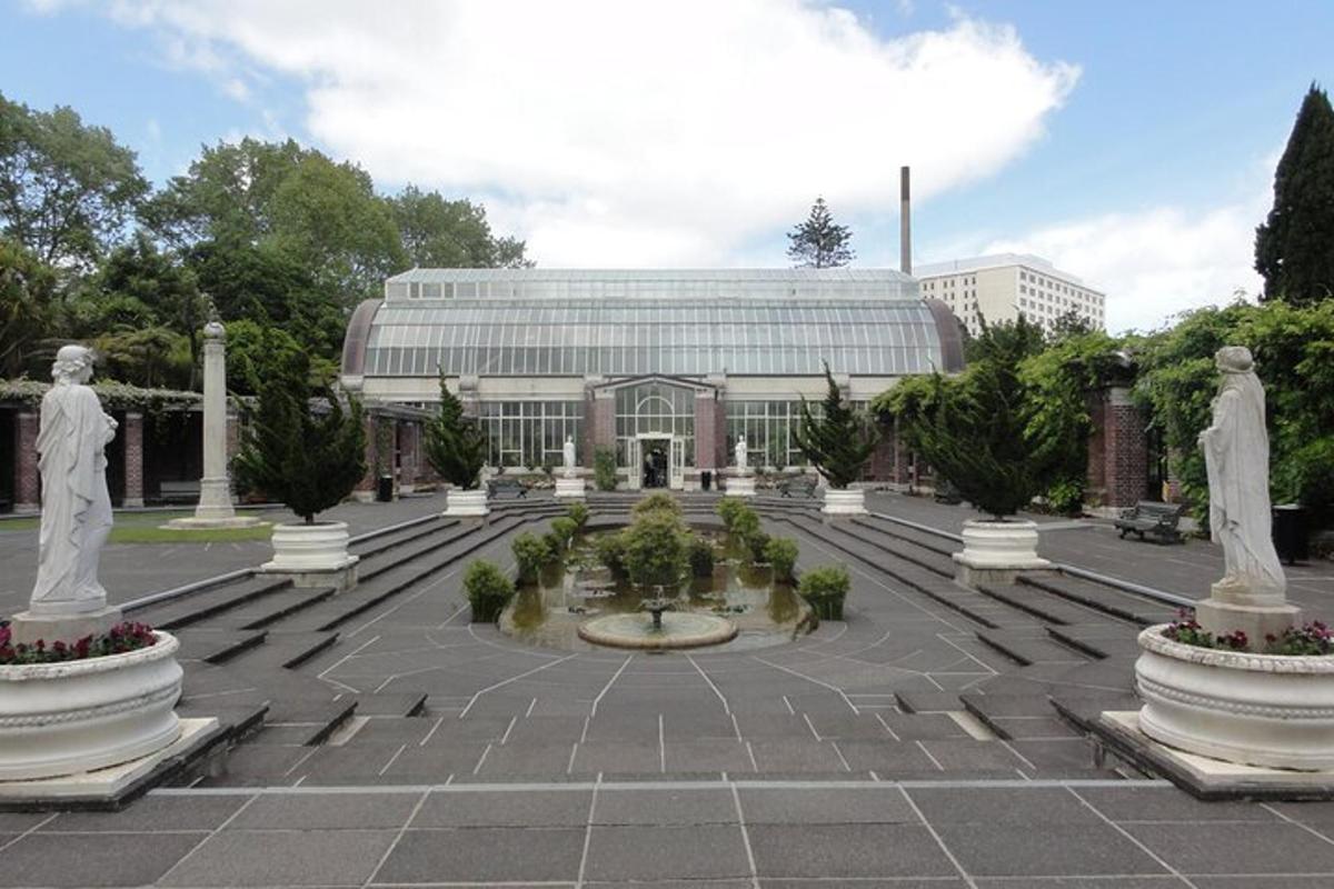 a building with statues in the middle of a courtyard