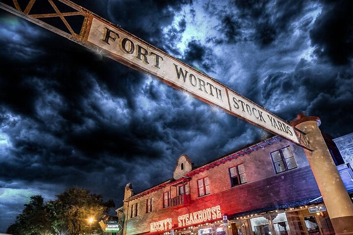 a street sign in front of a building with a cloudy sky