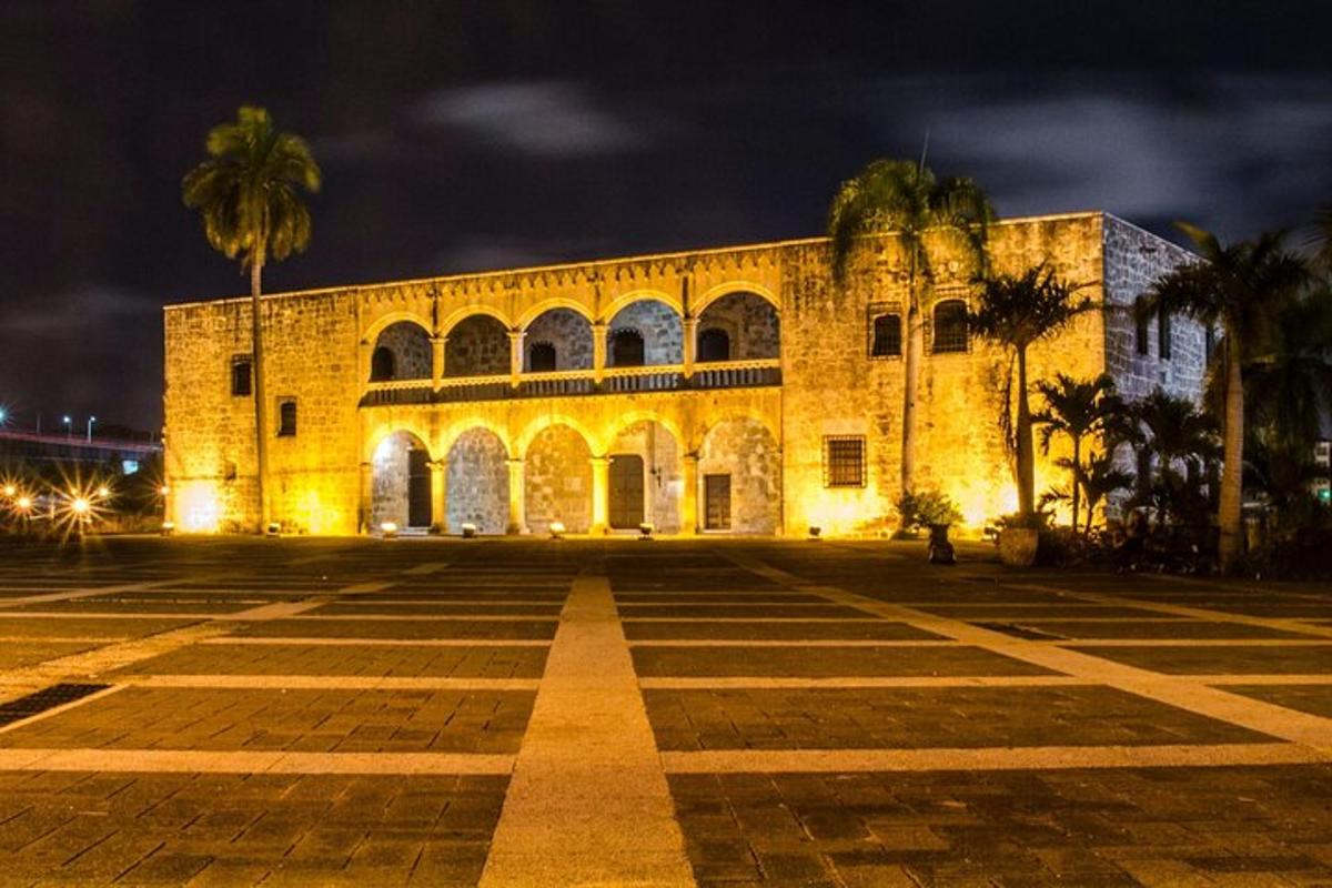 a large building with palm trees in front of it