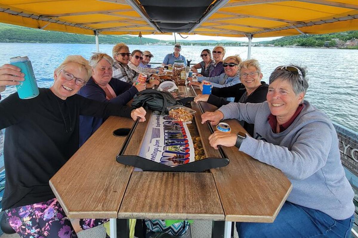 a group of people sitting at a table on a boat