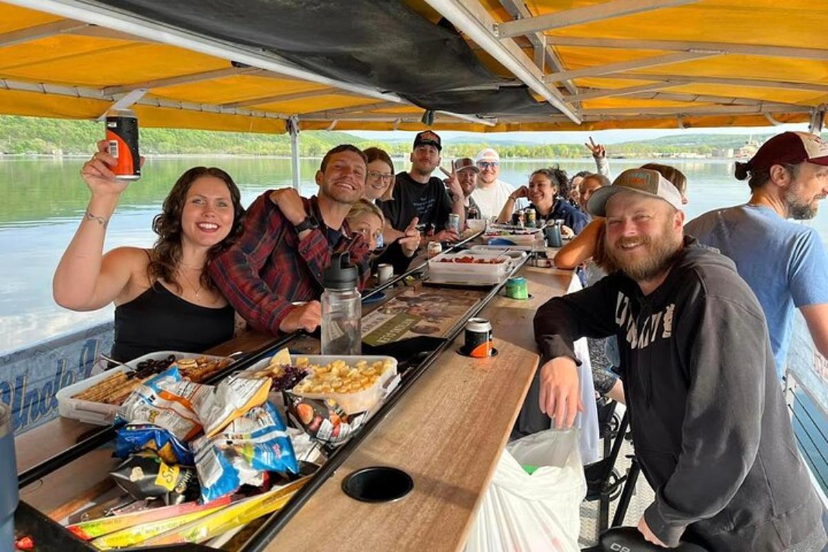 a group of people sitting at a table on a boat