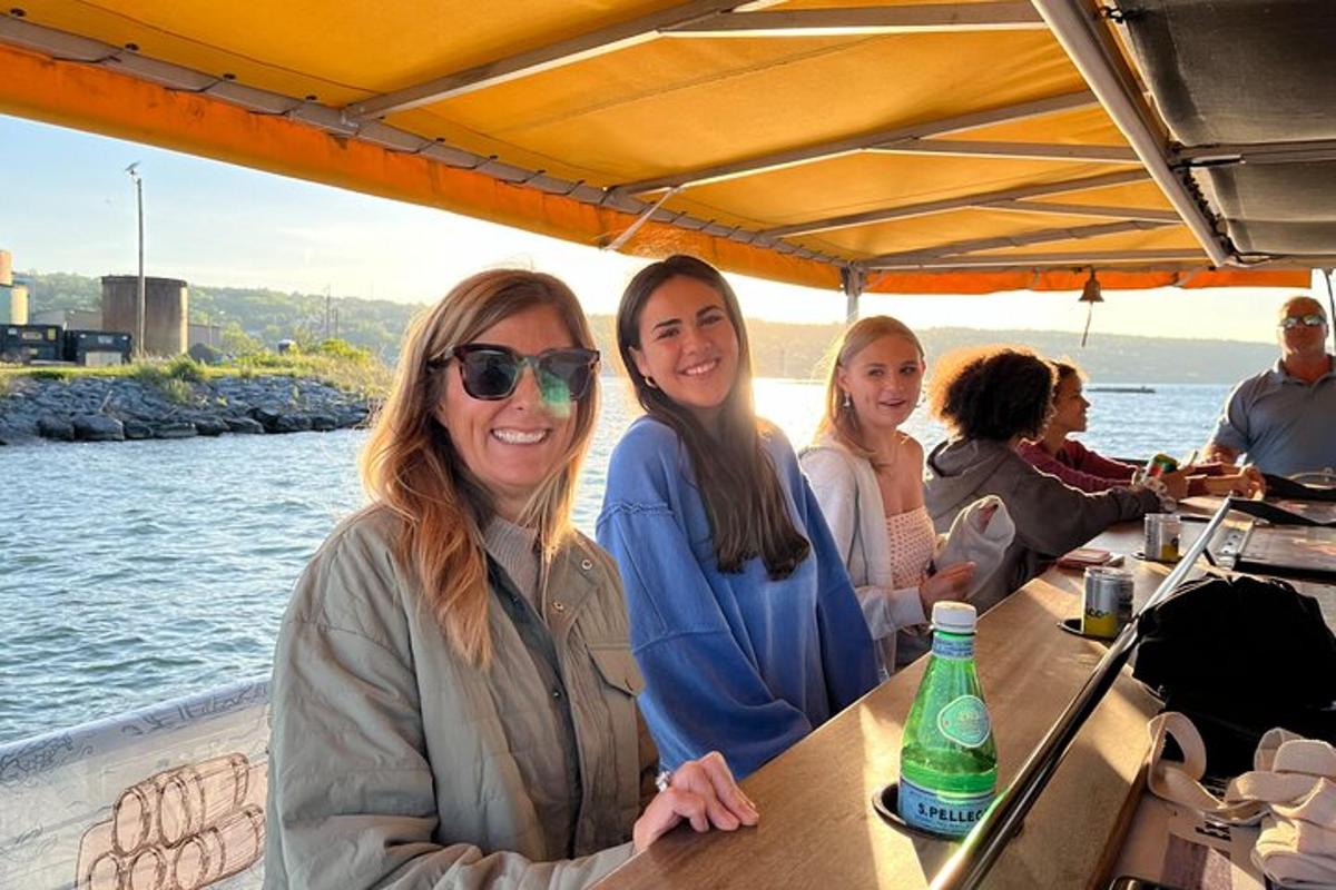 a group of women sitting at a table on a boat