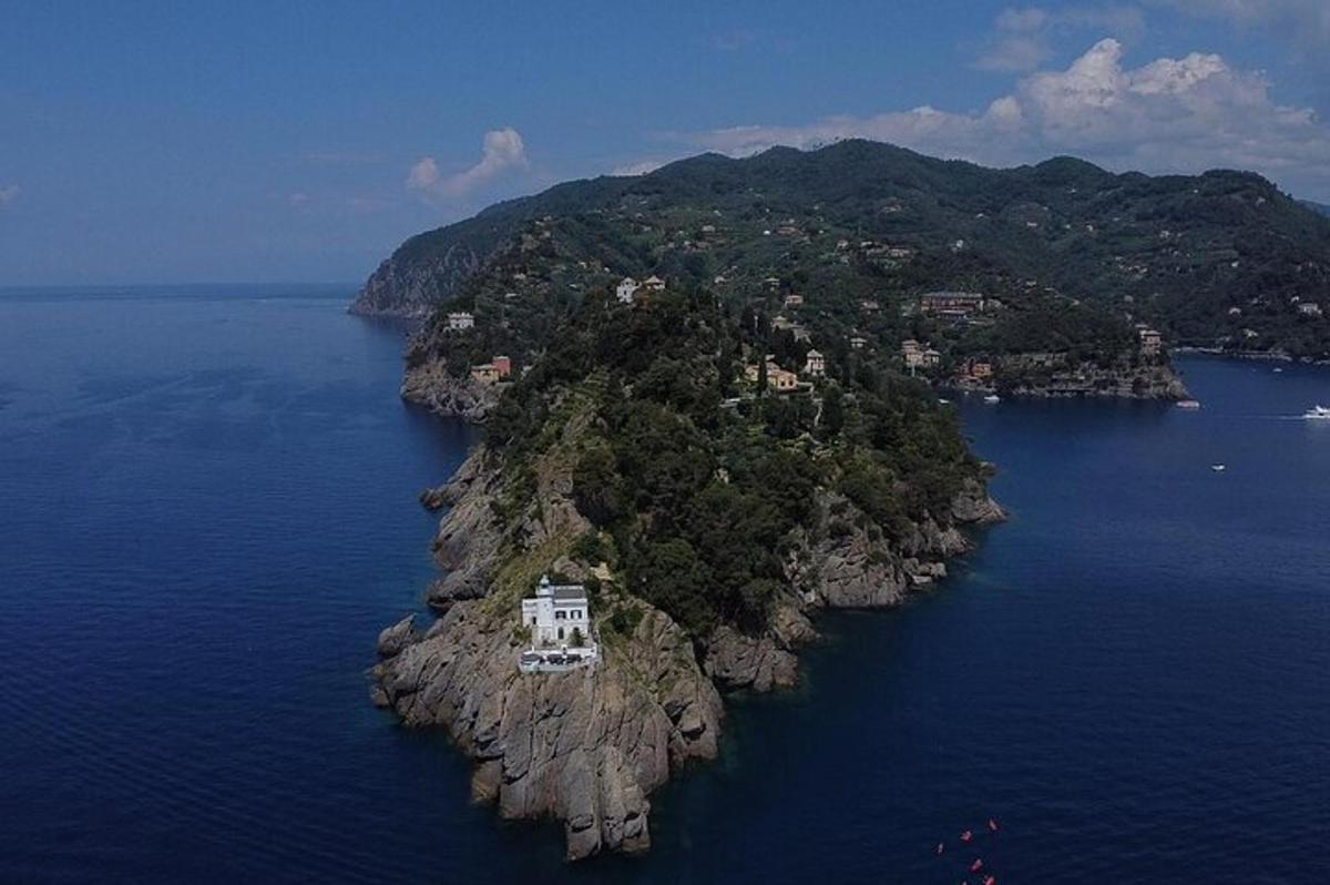 an island in the water with a house on it