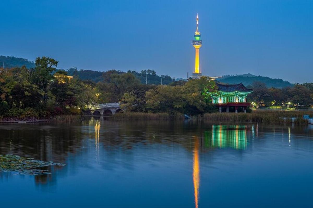a view of a river with a tower in the background