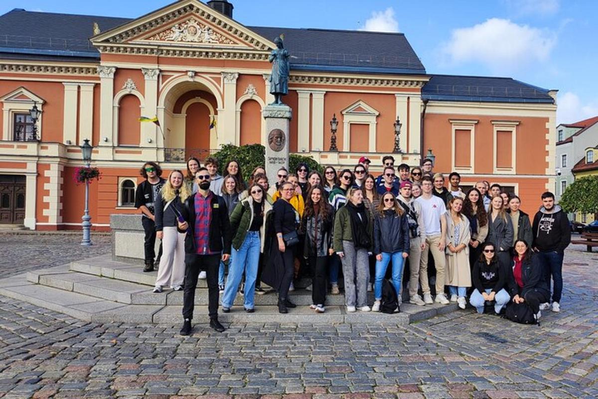 a group of people standing in front of a building