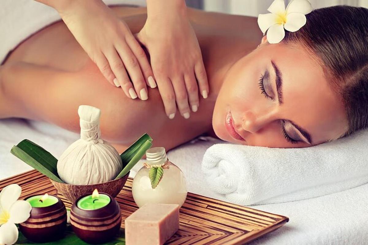 a woman laying on a bed in a spa with spa products