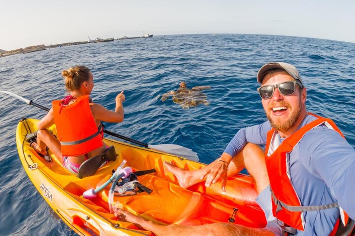 a man and a child in a kayak in the water